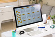 © Pixel-Shot - Medical appointment scheduling and healthcare planning, 2027 calendar on computer screen at doctor office desk with stethoscope and medical supplies