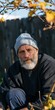 © Andrii Zastrozhnov - Outdoor autumn portrait of a mature bearded man wearing a light beanie and sweater for portrait background and personal branding use