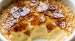 © MS.muushd - Close up of a delicious homemade vanilla bean creme brulee dessert with a cracked caramelized sugar crust.