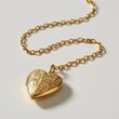 © Anik - Gold heart locket pendant on a delicate chain resting on a clean white background