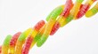 © Iman - Colorful gummy worm candies twisted together isolated on white background