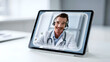 © Luminary Shots - Smiling doctor wearing headset and stethoscope appearing on digital tablet screen for telemedicine consultation