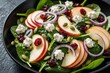 © miss irine - Fresh spinach salad with apple slices, goat cheese, dried cranberries, red onion rings, pepitas in black bowl. Healthy meal presentation, vibrant colors, delicious ingredients, garden greens make