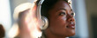 © ivlianna - Female veteran in her 30s attending language class indoors with headphones