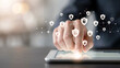 © Abdul Latif - Finger touching tablet screen with digital security network overlay during data protection concept