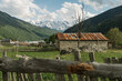© Anna Sorokina/Stocksy - Rustic stone house with snowy mountains