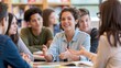 © AZ Studio - Diverse college students engaged in lively discussion and learning at tables