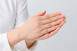 © Keopaserth - Hand gesture close up female hand clasped hand palm skin finger manicure white sleeve gesture