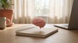 © PRIYA - A Thoughtful Moment: A realistic 3D render of a human brain levitating above a notebook, with a speech bubble containing ellipses indicating thought or contemplation.