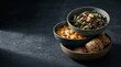 © anggasugara - Healthy Vegetable Soup with Steam served with Kale Quinoa Salad and Whole Grain Bread on Dark Texture