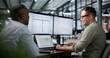 © Andrey Popov - Human Resources Manager Analyzing Employee Performance Data