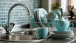 © 69 - Stack of clean turquoise ceramic cup plate bowl in drying rack on stainless steel kitchen sink countertop with chrome water faucet and turquoise mosaic tile wall