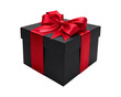 © IBRAHIM - Elegant black gift box tied with a bright red satin ribbon bow isolated on a black background
