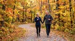 © Maicon - A happy mature couple walks hand in hand on a scenic path through a forest filled with vibrant autumn leaves, enjoying a healthy outdoor activity together.