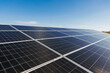 © wedmoments.stock - Rows of photovoltaic panels installed on a building roof for renewable electricity production. Concept solar power, decarbonization and the future of sustainable energy.