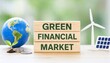 © Md - Green financial market concept with globe renewable energy symbols