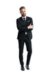 © Viorel Sima - Elegant man in black suit standing with crossed arms