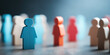 © sam richter - an array of human-shaped wooden figures in shades of blue, red and orange representing diverse groups within an organization.