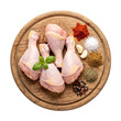 © MSTFatemaAkter - Raw chicken drumsticks with spices and herbs on wooden cutting board provide essential ingredients for fresh culinary preparation and home cooking recipes.