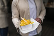 © Lupe Rodriguez/Stocksy - Close up of traditional Belgian fries with sauce to go