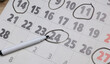 © splitov27 - Paper calendar with numbers circled on the table