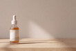 © Jose Tirado - Skincare cosmetic dropper bottle on wooden table