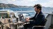 © Premu - man working on laptop computer on ferry deck while traveling at sea