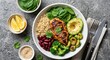 © Veloria - Healthy Buddha bowl with grilled chicken, quinoa, avocado, broccoli, beans, and fresh spinach on a grey stone background. Perfect for nutritious meal planning and clean eating lifestyle concepts.