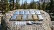 © AbulAI - Emergency survival ration bars and medical pills on rock outdoors