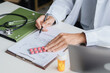 © Charlie's - Doctor Explaining Prescription Treatment and Medication Use as Part of Professional Patient Care and Digital Healthcare Service.