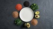 © Berkah - Empty white ceramic plate surrounded by colorful fresh organic ingredients
