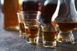 © Studio Nova - The Whiskey Glasses on Rustic Table in Warm Ambient Light