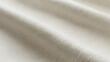 © Creative Assets Hub  - Close up of soft beige fabric texture with subtle diagonal folds and fine woven threads, textile neutral color, smooth surface, drapery, clothing minimalist background, macro shot