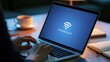 © AZ Studio - Person typing on laptop with Wi-Fi connection lost error message on screen