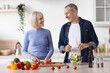 © Prostock-studio - Smiling Elderly Caucasian Couple Cooking Together In Modern Kitchen, Preparing Fresh Salad With Various Vegetables And Ingredients, Enjoying Time Together In Home, Healthy Eating Concept.