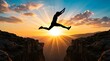 © MindsTock - Person leaping across deep rocky canyon gap at sunset with dramatic sun rays bursting behind them representing courage success transformation and achieving big goals against all odds outdoors