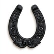 © Generative AI - Ornate black horseshoe with carved floral designs on