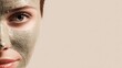 © THE IZEL ART - woman wearing clay face mask on clean beige background