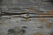 © Михаил Кривовяз - Close-up of aged weathered wooden planks with cracked, peeling, and rough natural grain. Gray and brown tones create a rustic, distressed surface texture suitable for backgrounds, vintage designs, con