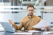 © Liubomir - Workplace stress and professional burnout, frustrated businessman looking at documents with confusion in modern office. Stressed employee reviewing paperwork and analyzing data with deadline pressure.