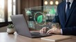 © Rennyks - Professional analyzing environmental sustainability dashboard with holographic green energy icons