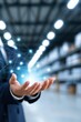 © Generative AI - Businessman holding glowing network nodes in warehouse