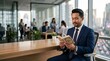 © Irfan - Professional Muslim businessman in a blue suit sitting in a modern high-rise office while reading the Quran peacefully during a break with a city skyline background