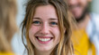 © Sabana - Close up portrait of a young smiling woman with long highlighted hair