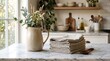 © Kalyarat Mnakla - Elegant pitcher on marble table with linen napkins in cozy kitchen setting