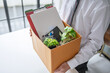 © Charlie's - Businessman Carrying Cardboard Box packing Stuff Resign Depress or carrying business cardboard box Change of job or fired from company resign.