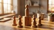 © Chayanan - Leadership and management concept showing responsibility and team workflow using wooden figures.