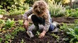 © Rinijus - Young girl tending vegetables in a garden