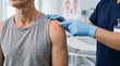 © JUST 4U STOCK  - Healthcare professional examining shoulder injury of a patient in a clinic setting to assess musculoskeletal pain and joint inflammation