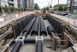 © Ahmed - Underground utility pipes installation in urban construction trench with modern infrastructure